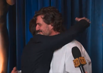 Kieran Culkin and Pedro Pascal embracing