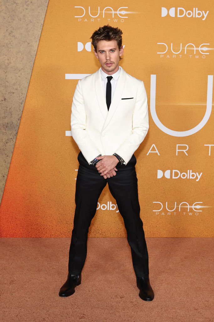 Austin in white blazer and black trousers standing with hands in pockets at &#x27;Dune: Part Two&#x27; event