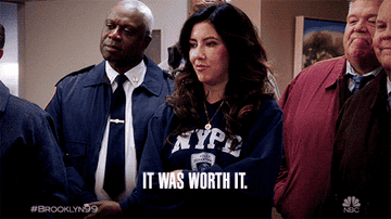 Four characters from Brooklyn Nine-Nine with text caption "It was worth it."