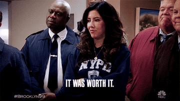 Four characters from Brooklyn Nine-Nine with text caption &quot;It was worth it.&quot;