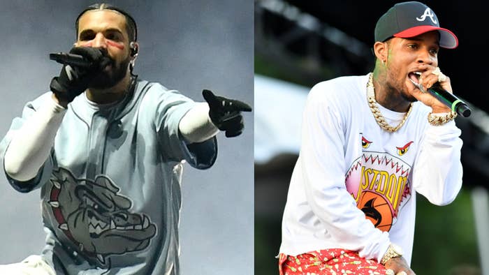 Drake in a graphic tee and Tory Lanez in a printed white tee perform on stage