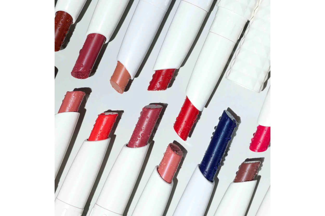 Variety of lipsticks in different shades and one with a unique blue color, angled placement