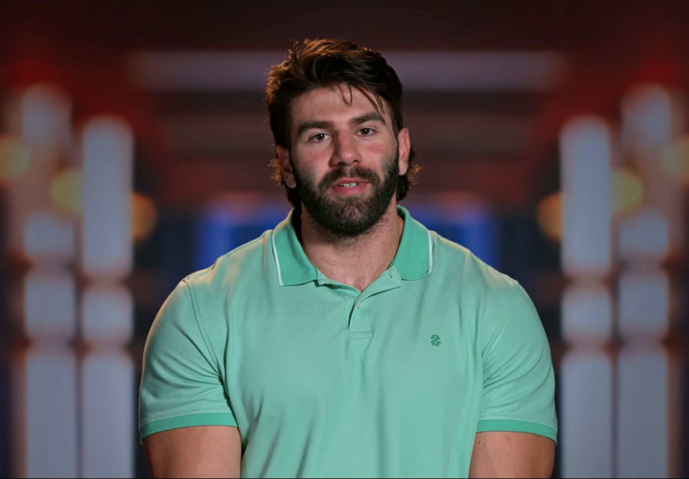 Trevor with beard in polo shirt against blurred background