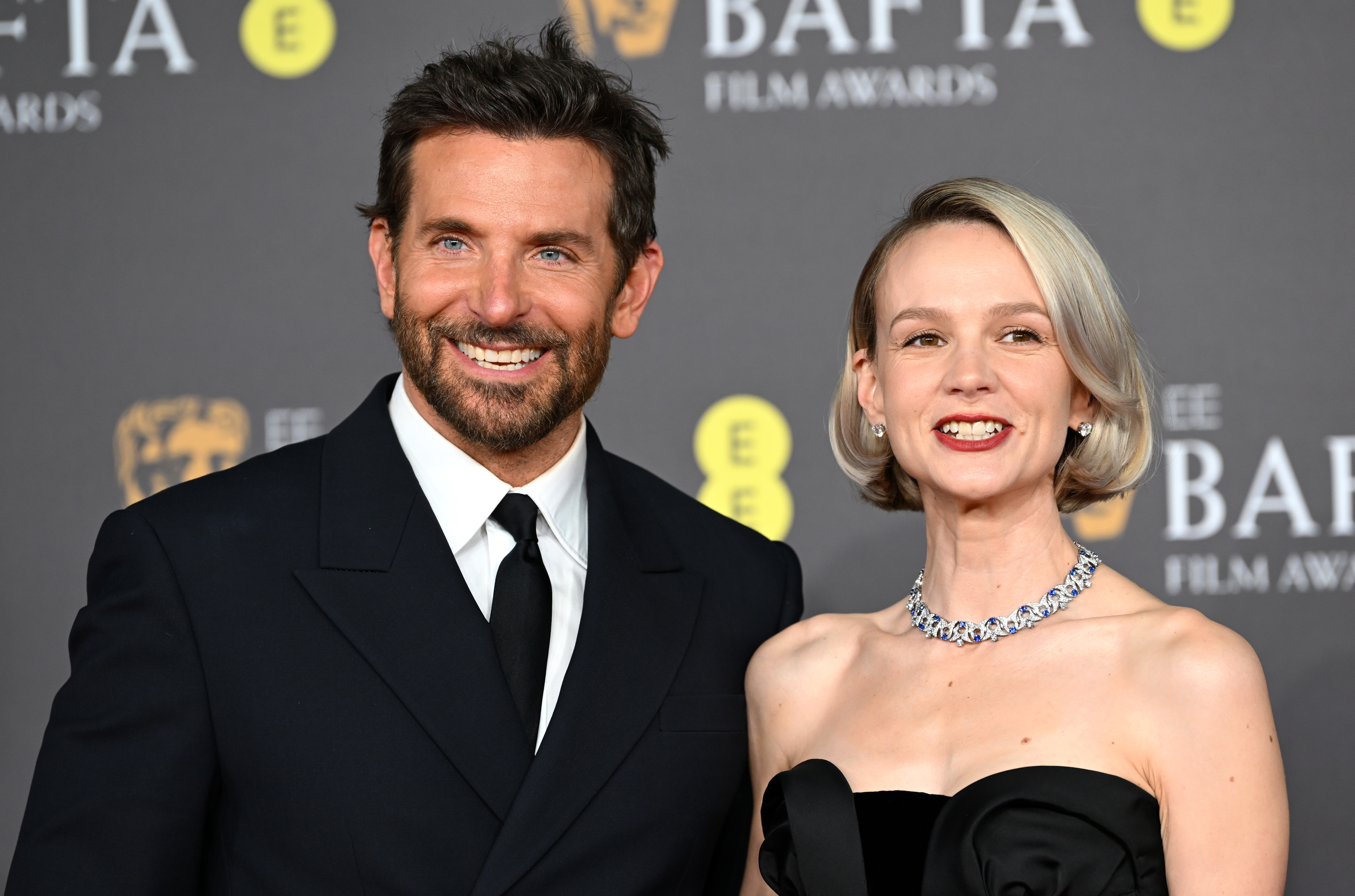 Closeup of Bradley Cooper and Carey Mulligan on the red carpet