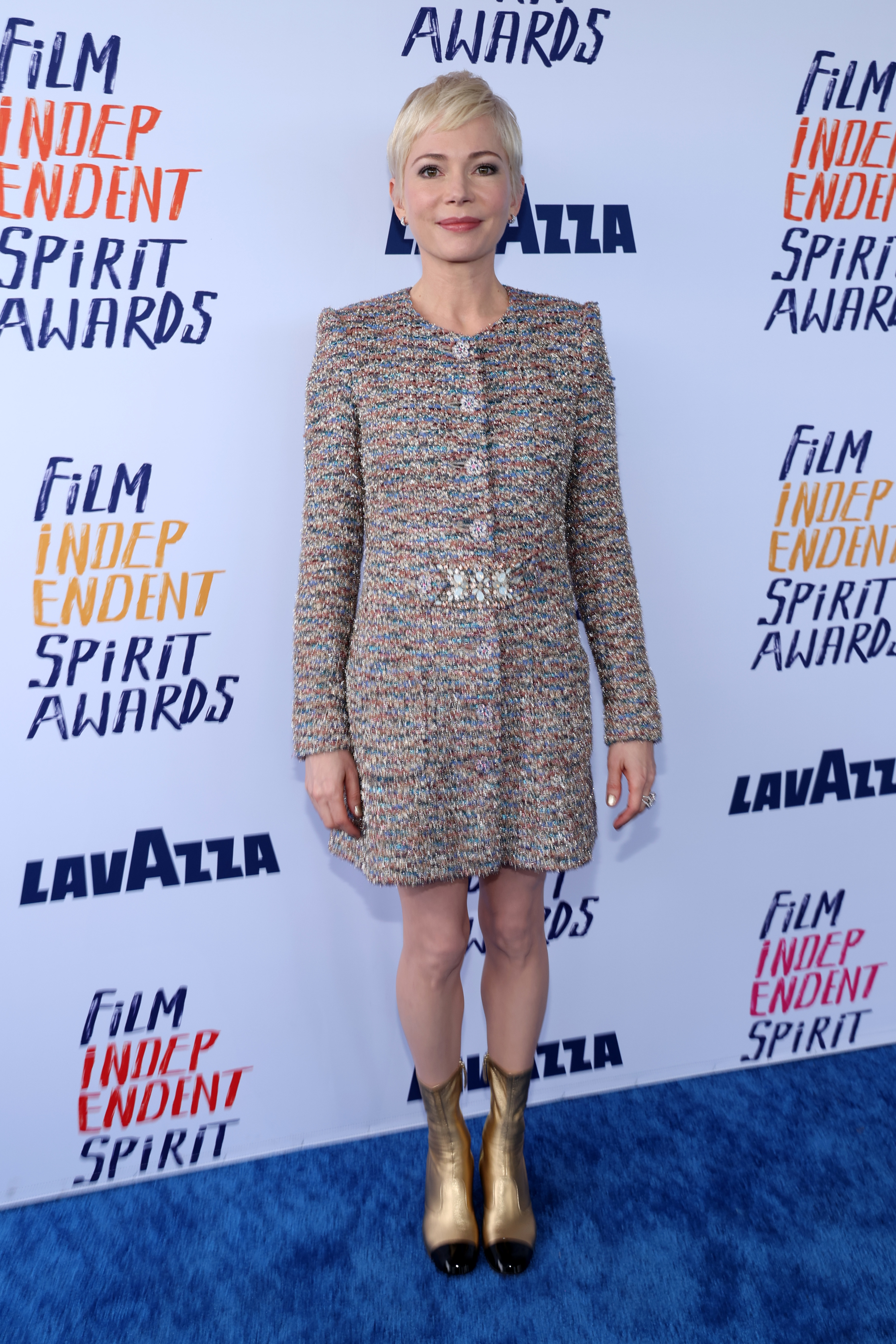 Michelle in a tweed jacket dress and metallic boots at the Film Independent Spirit Awards