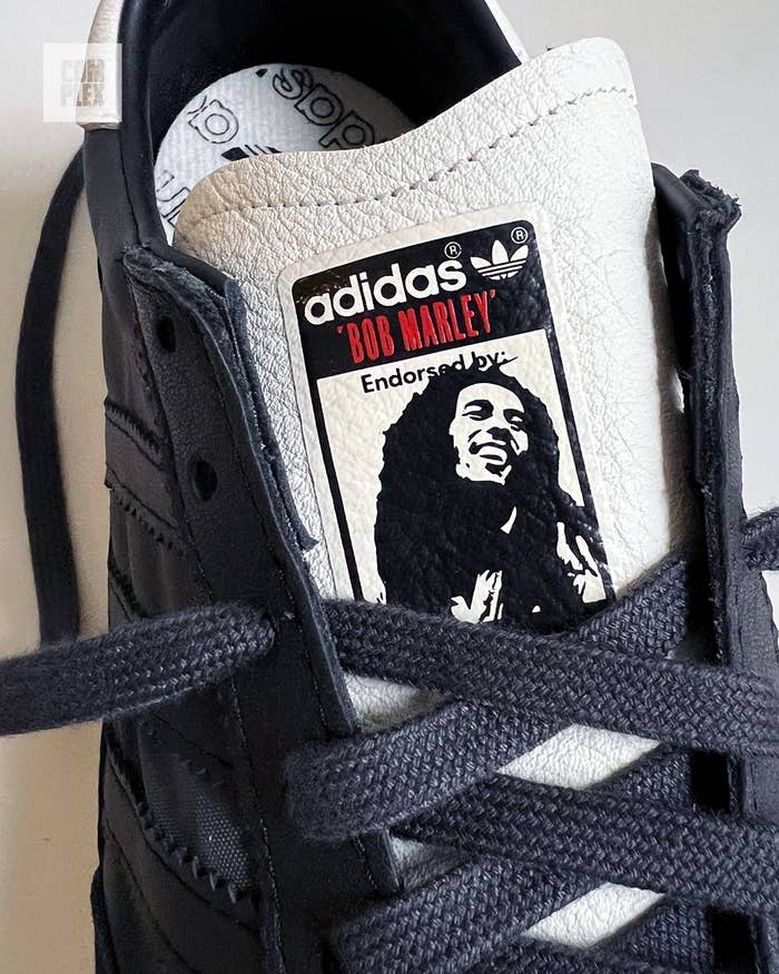 Close-up of an Adidas sneaker with a Bob Marley endorsement label on the tongue