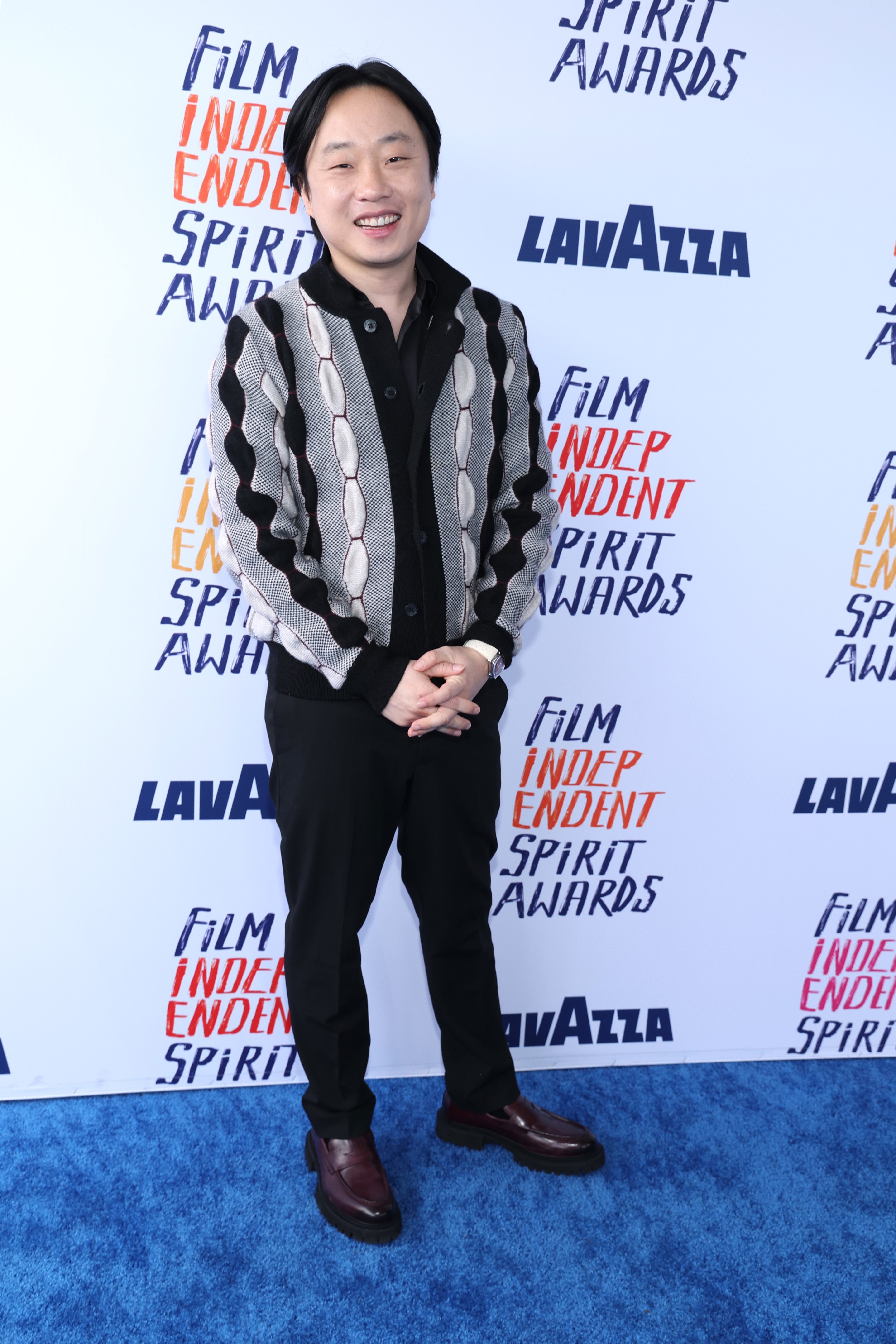 Jimmy in patterned jacket and shirt smiles at the Film Independent Spirit Awards