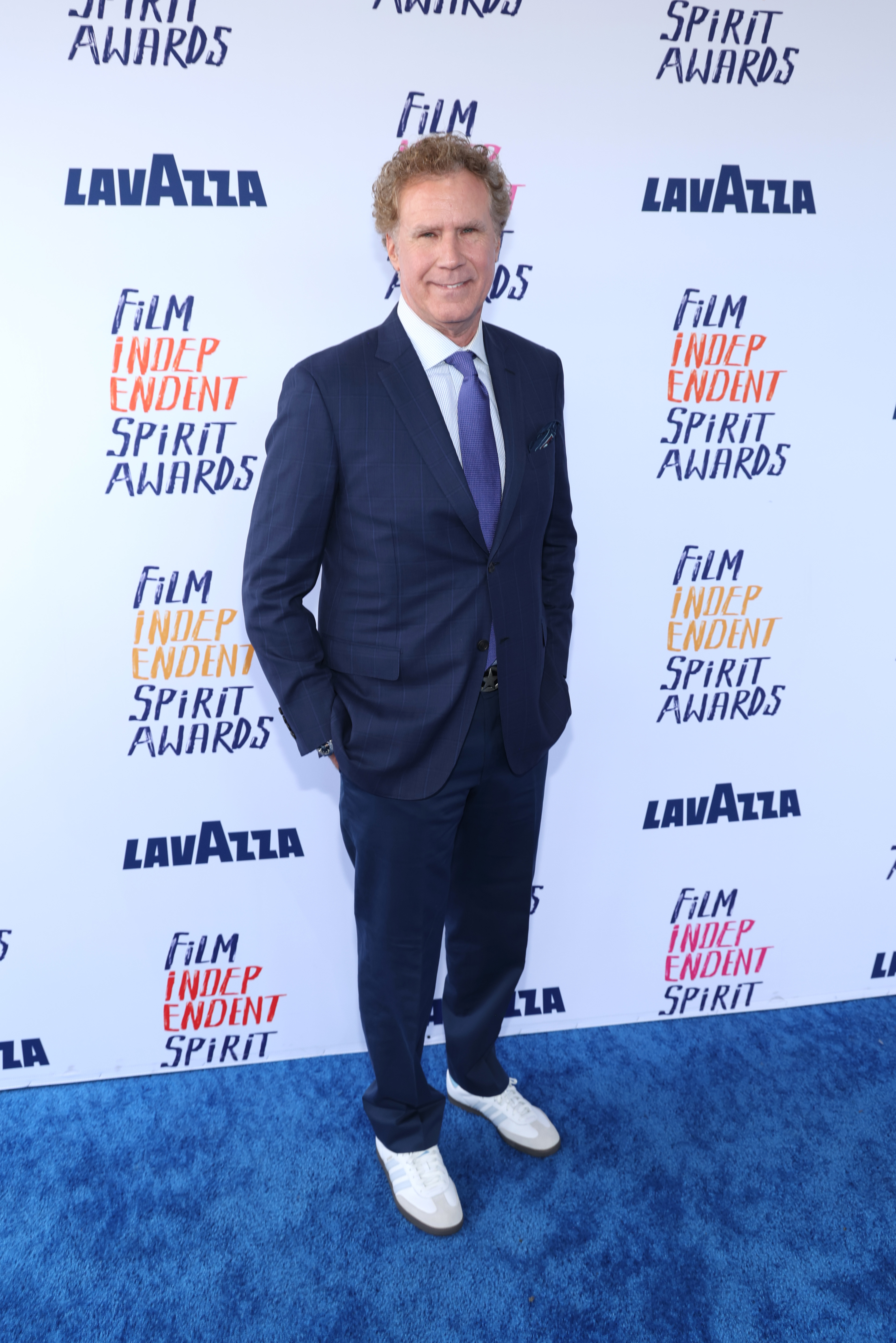 Will in a suit with a tie posing against a backdrop with &#x27;Film Independent Spirit Awards&#x27; logos
