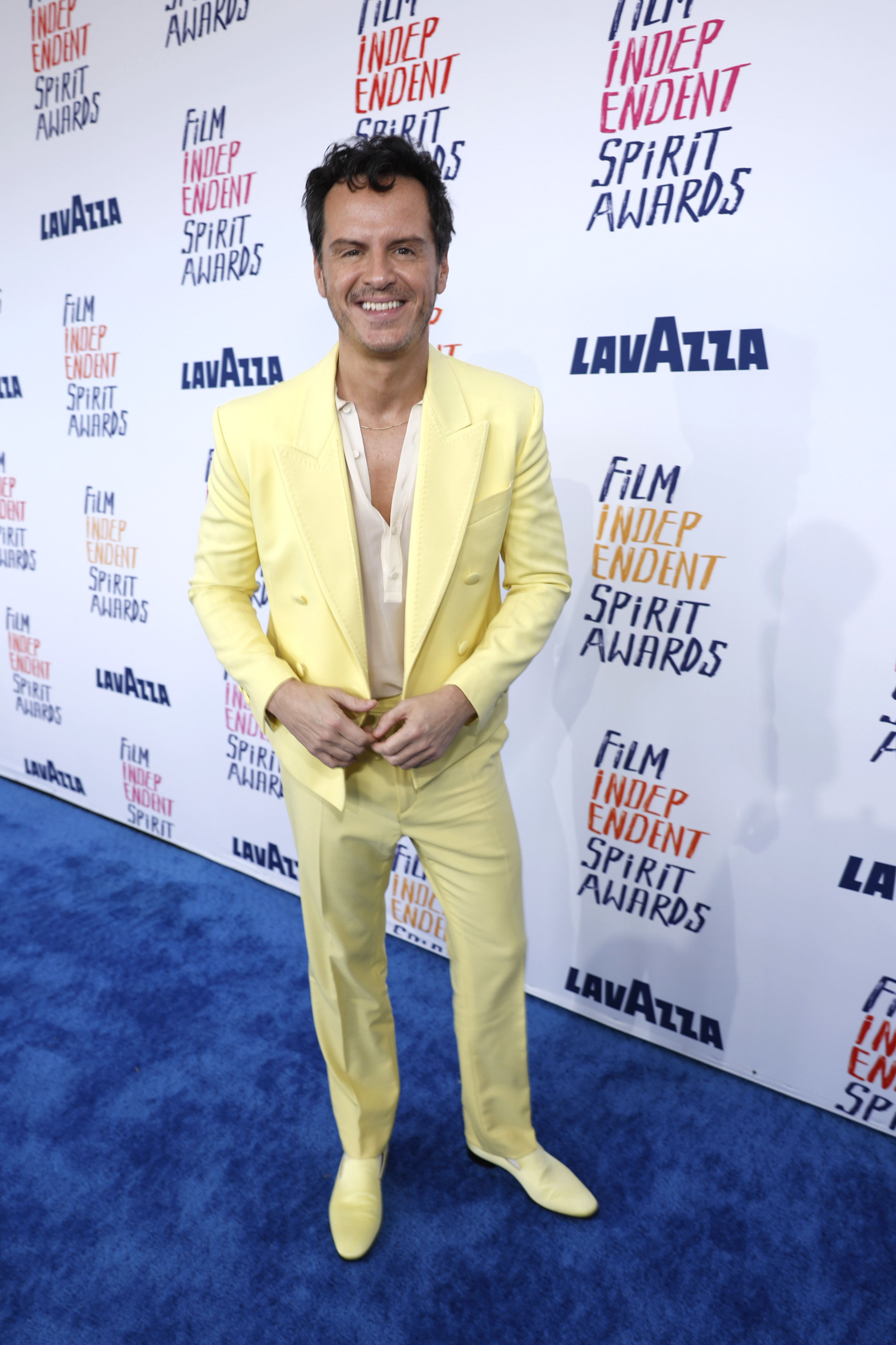 Andrew in a pastel suit smiling at the Film Independent Spirit Awards
