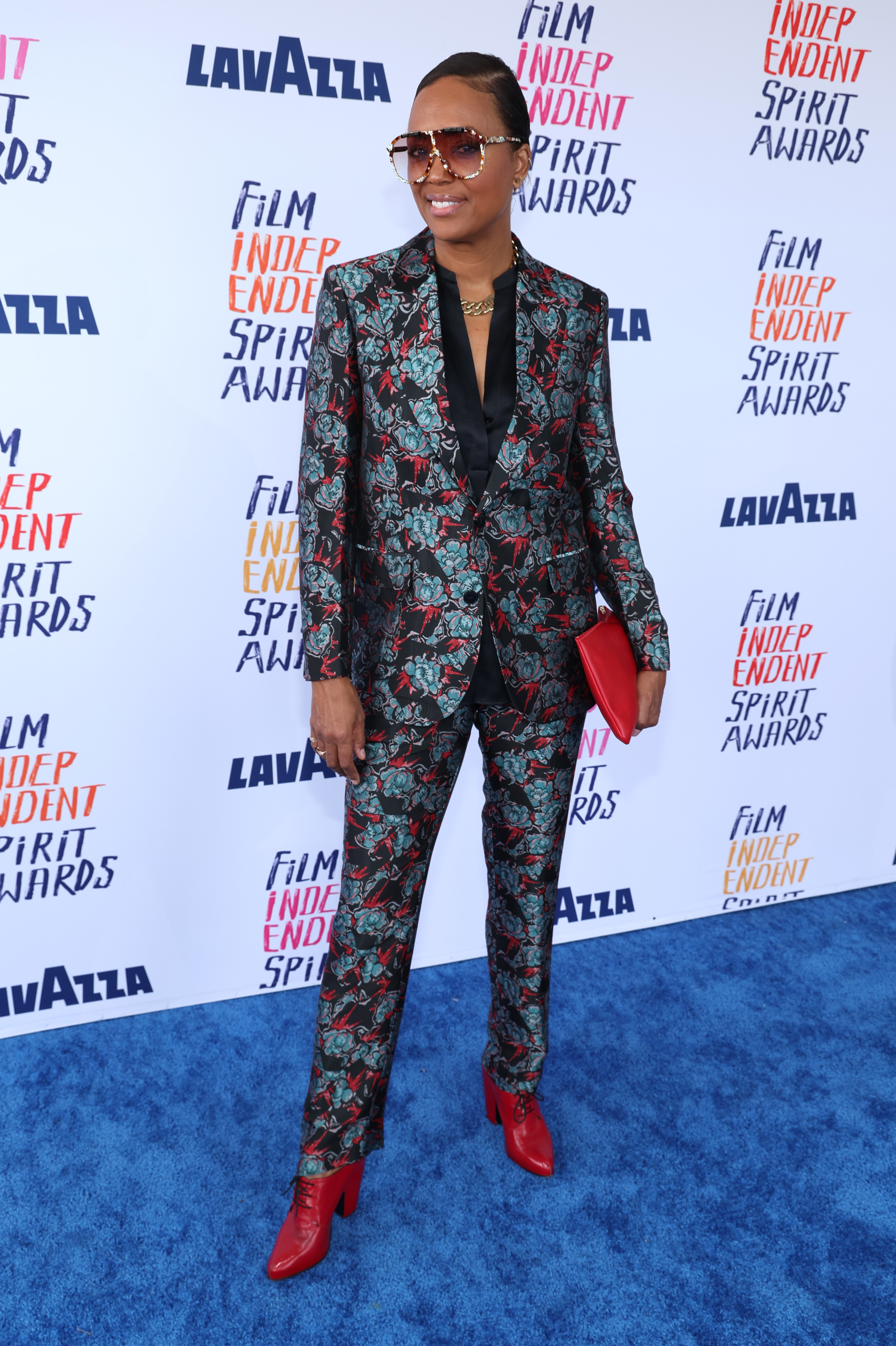 Aisha in patterned suit
