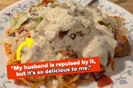 a plate of spaghetti topped with ranch and vegetables