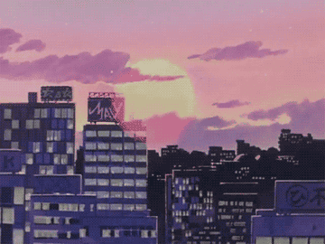 Animación de un atardecer con el sol bajando detrás de edificios urbanos