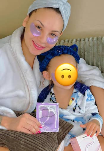 reviewer and child wearing the purple under eye patches