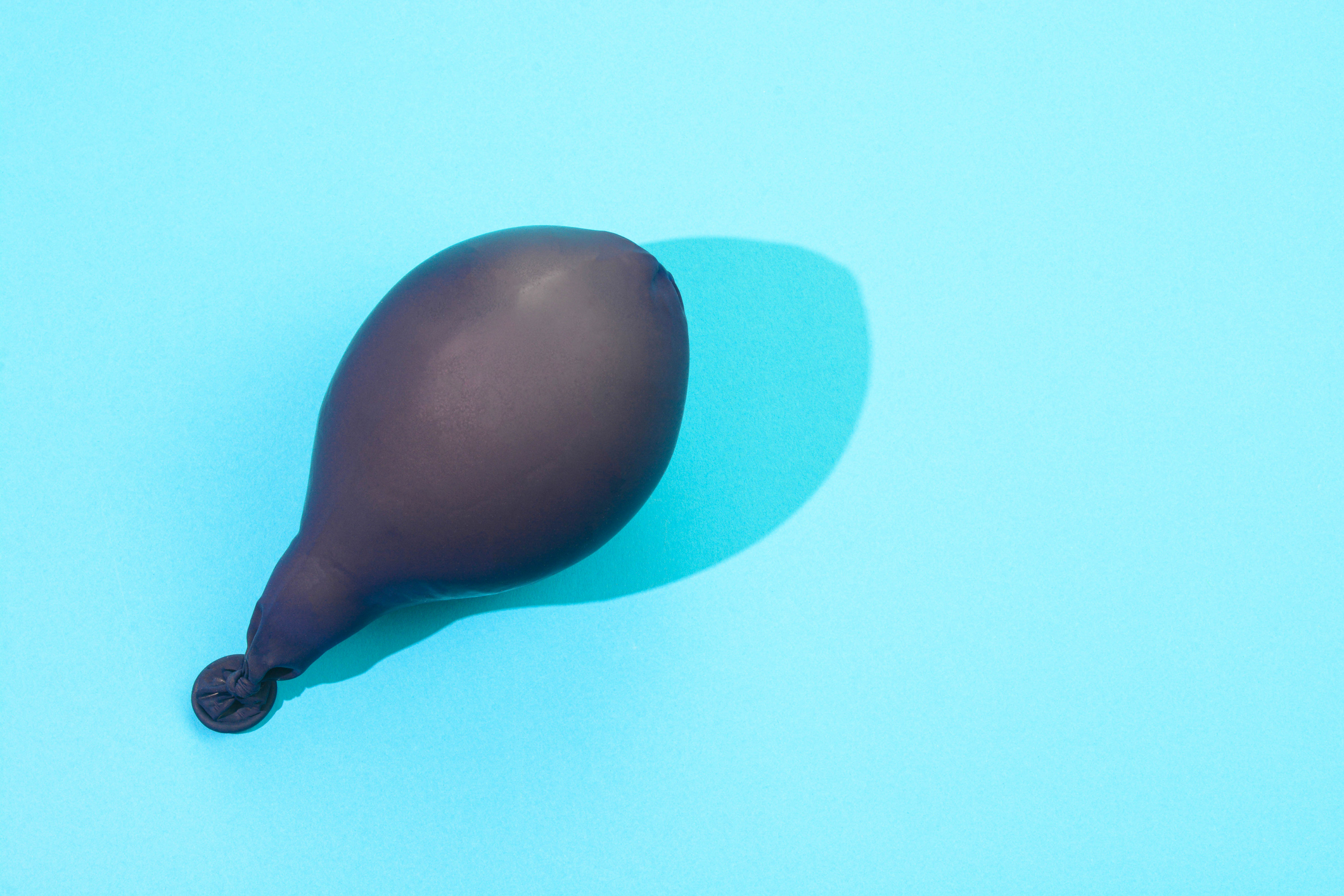 Inflated balloon on a plain surface, relevant to an article on Sex &amp; Love