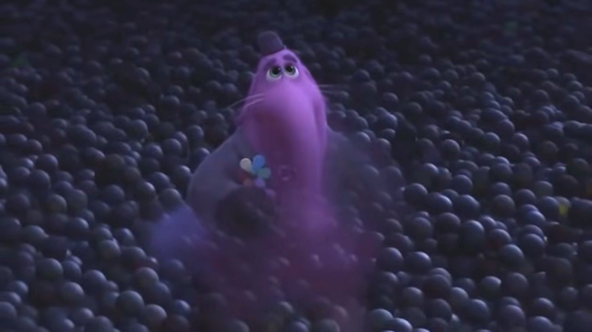 Bing Bong from Inside Out, sitting despondently among dark memory orbs