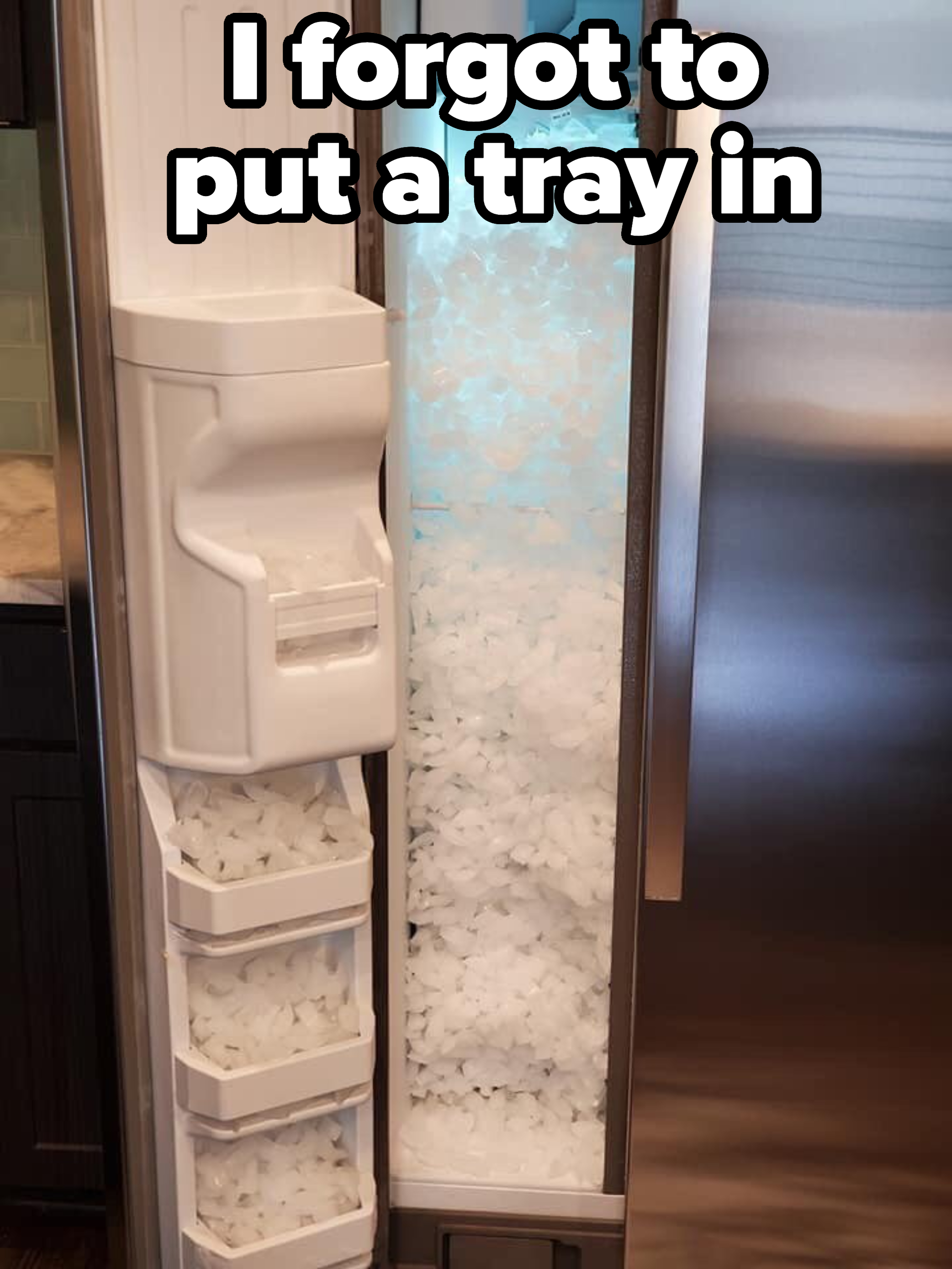 Refrigerator with an overstuffed ice dispenser, ice spilling out into interior, because person didn&#x27;t put a tray in