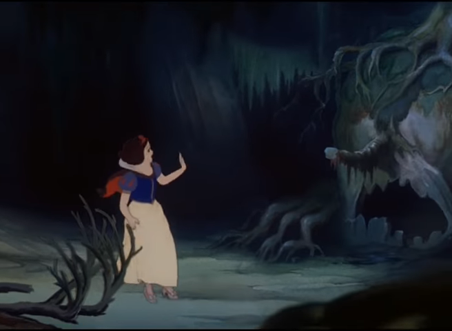 Snow White stands in a dark forest with a frightened expression
