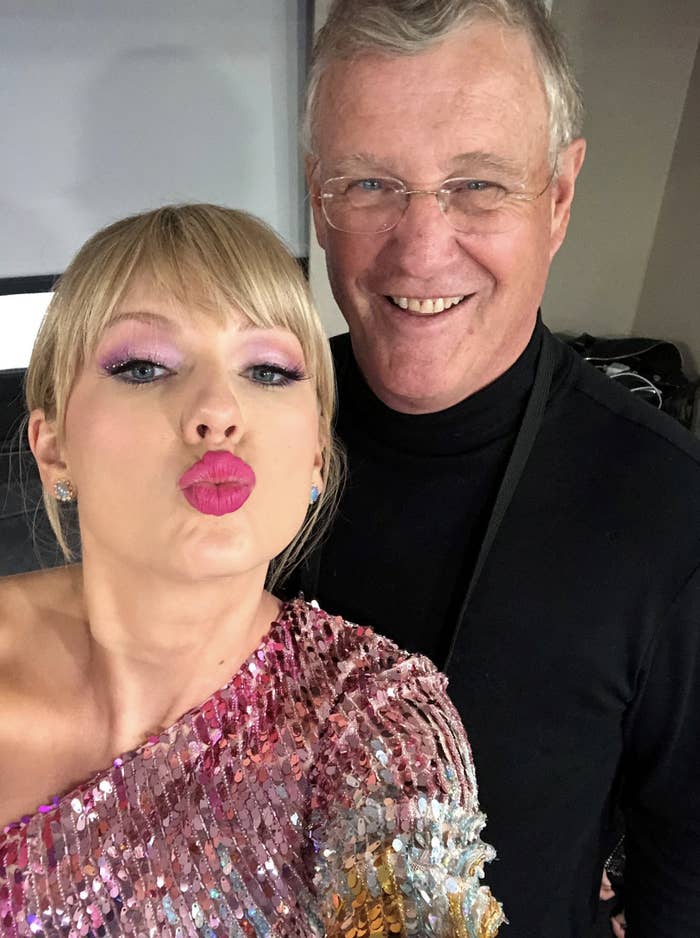 Taylor Swift and Scott Swift posing for a selfie; one with shimmering sequined attire, another in a black outfit