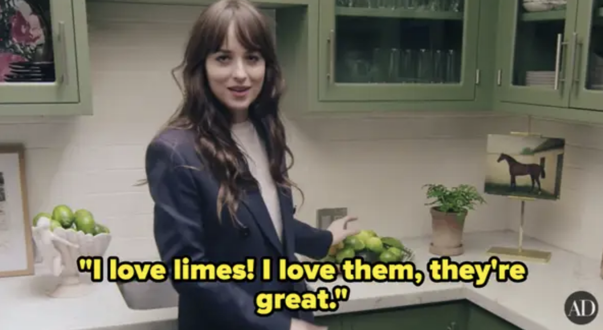 Dakota in a blazer standing in a kitchen with text &quot;I love limes! I love them, they&#x27;re great.&quot;