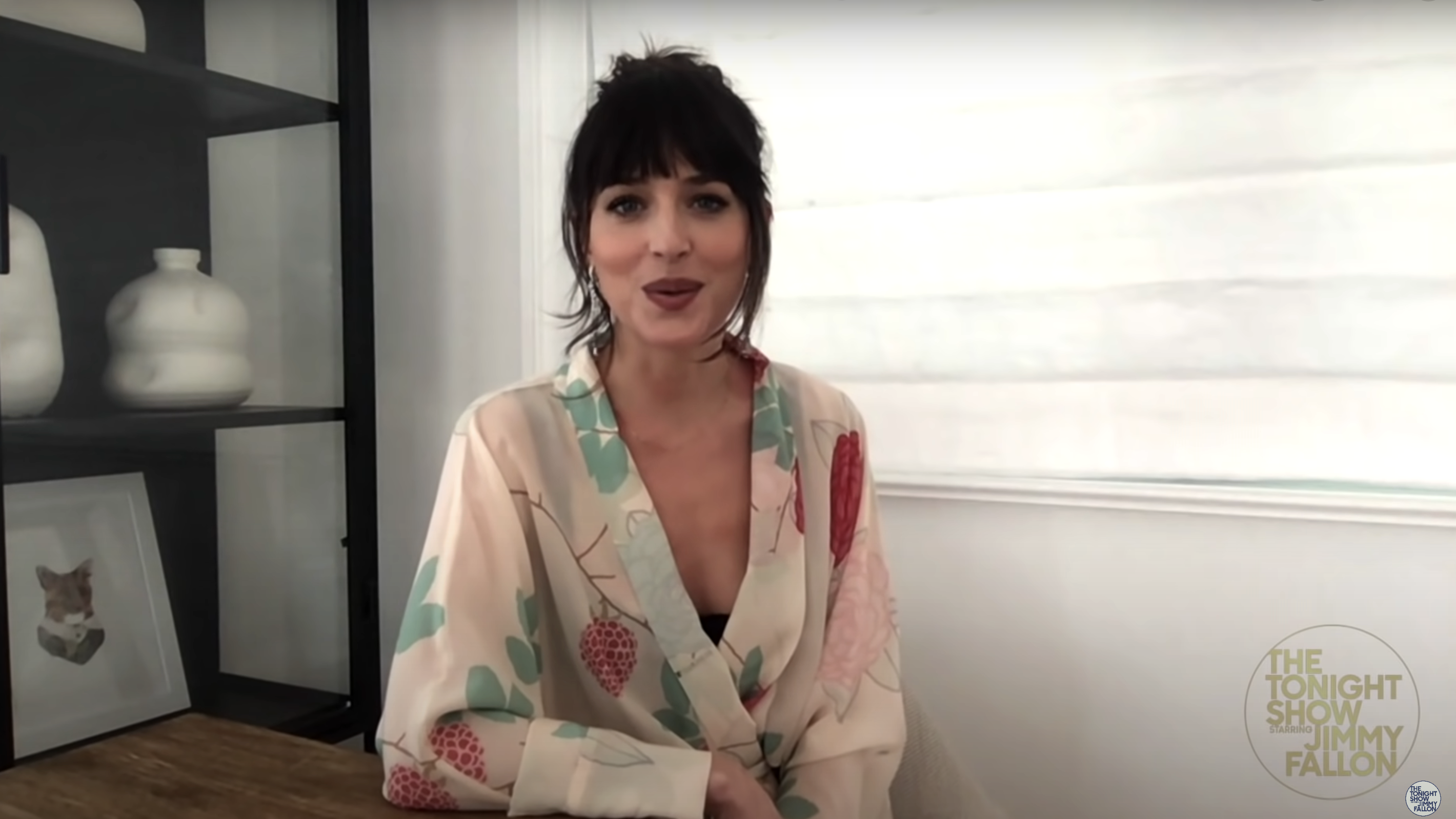 Dakota in patterned top on a video call with &quot;The Tonight Show Starring Jimmy Fallon&quot; logo visible