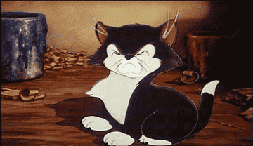 Animated character, Figaro the cat, looking frustrated with fists clenched, from Disney's Pinocchio