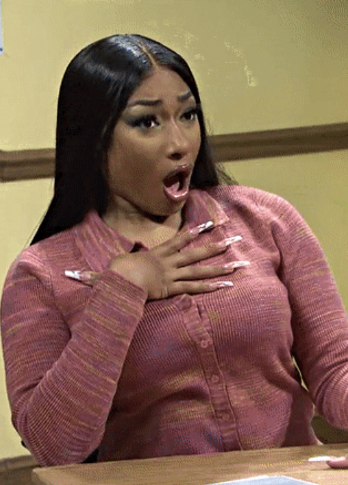 Megan Thee Stallion on &quot;SNL&quot; with her hand on her chest and mouth open in shock