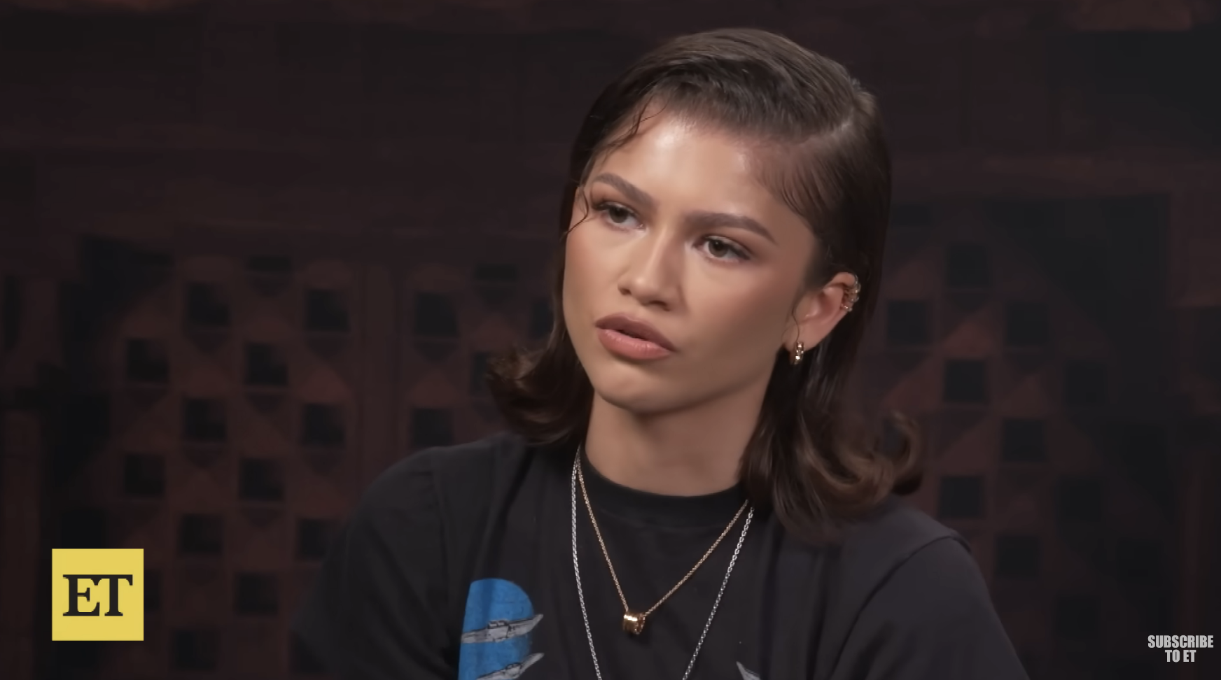Zendaya in a top, with layered necklaces, during an interview