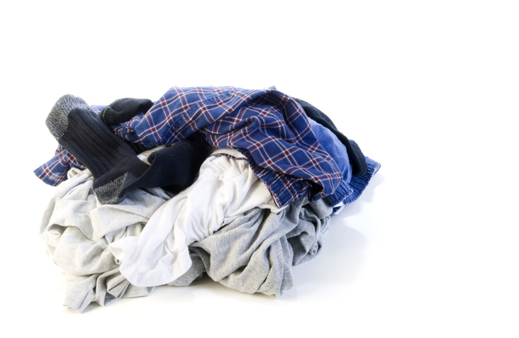 Pile of assorted men&#x27;s clothing including boxers and a sock