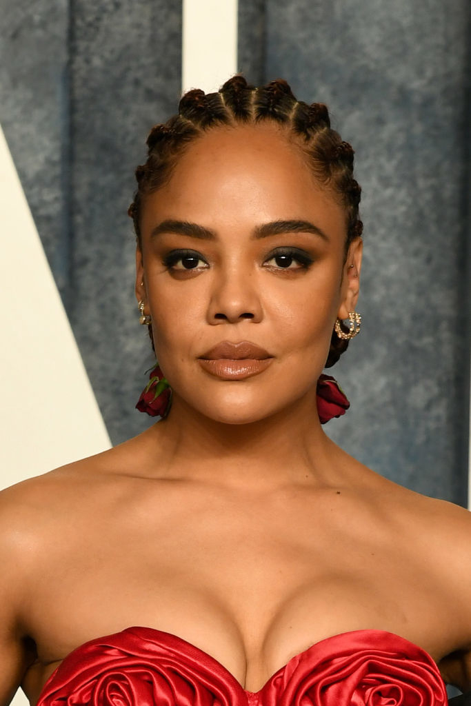 Actress with braided hair and a strapless gown