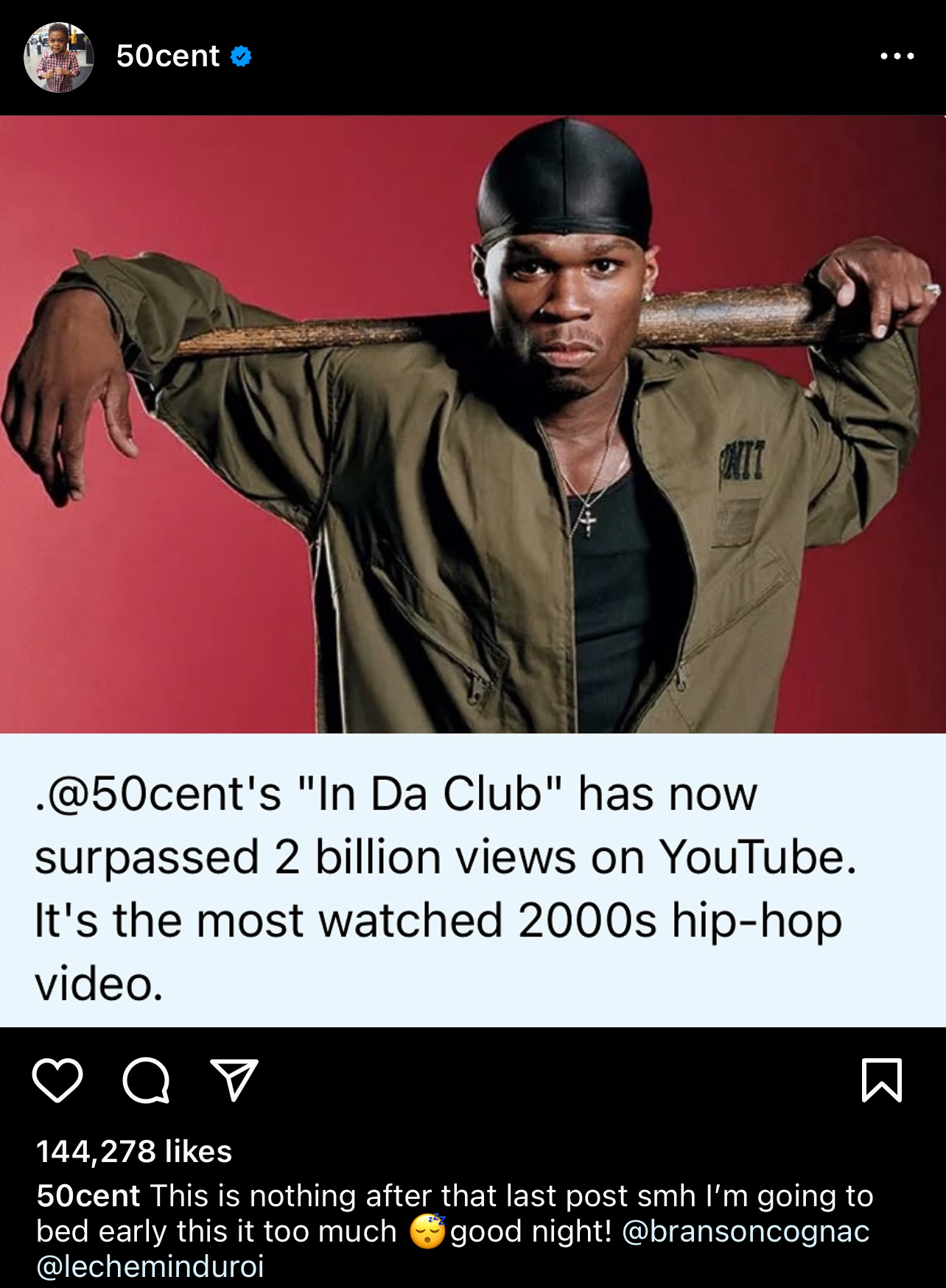 50 Cent poses with a baseball bat on his shoulders