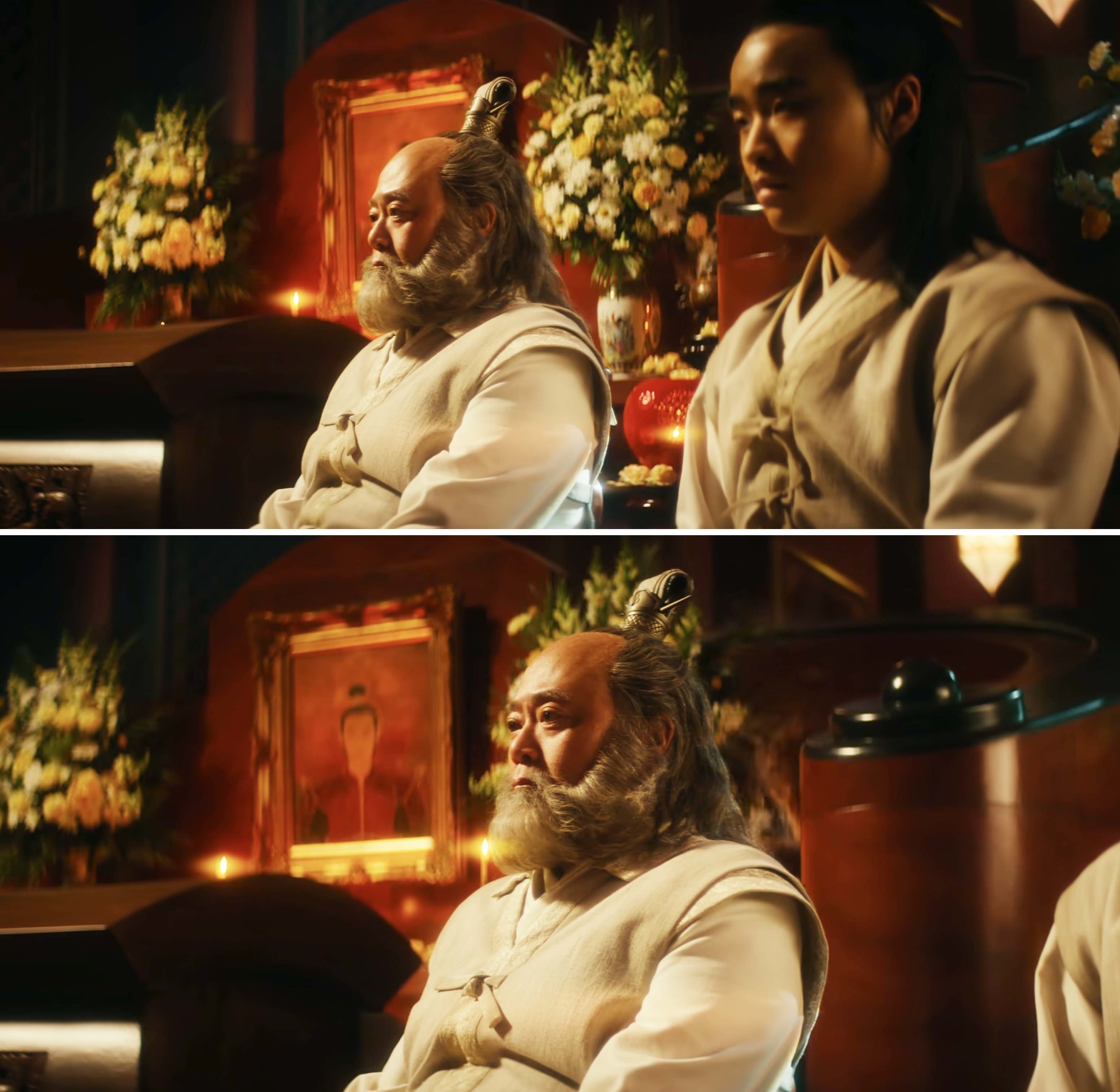 closeup of uncle iroh sitting in mourning
