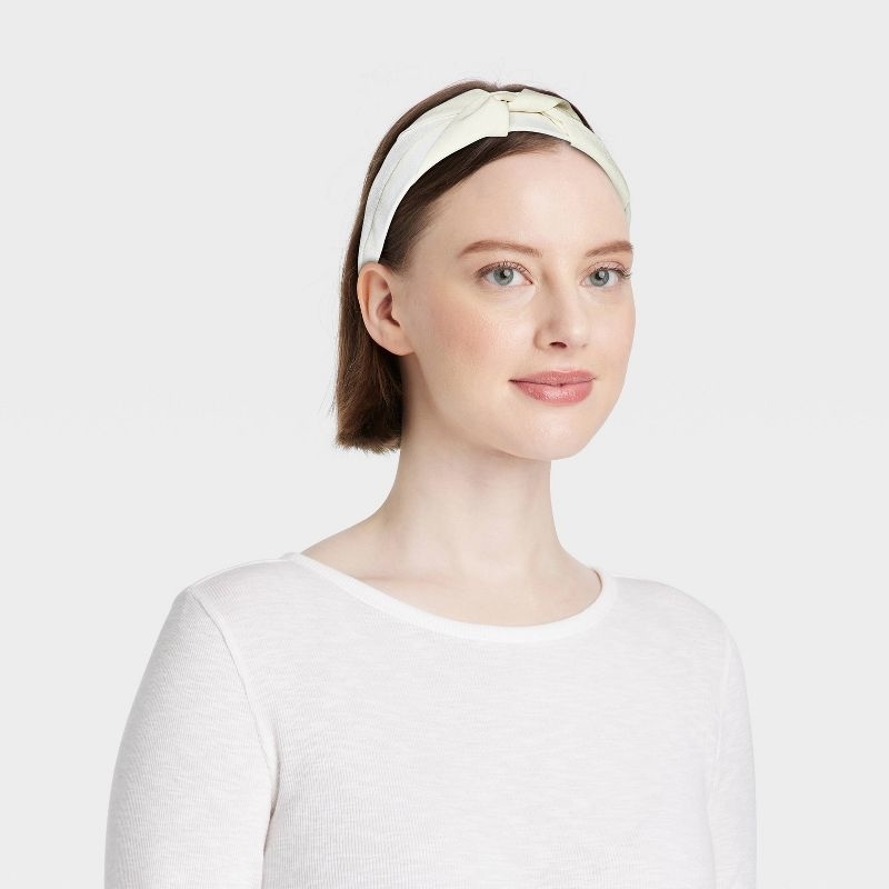 Model wearing the white headband