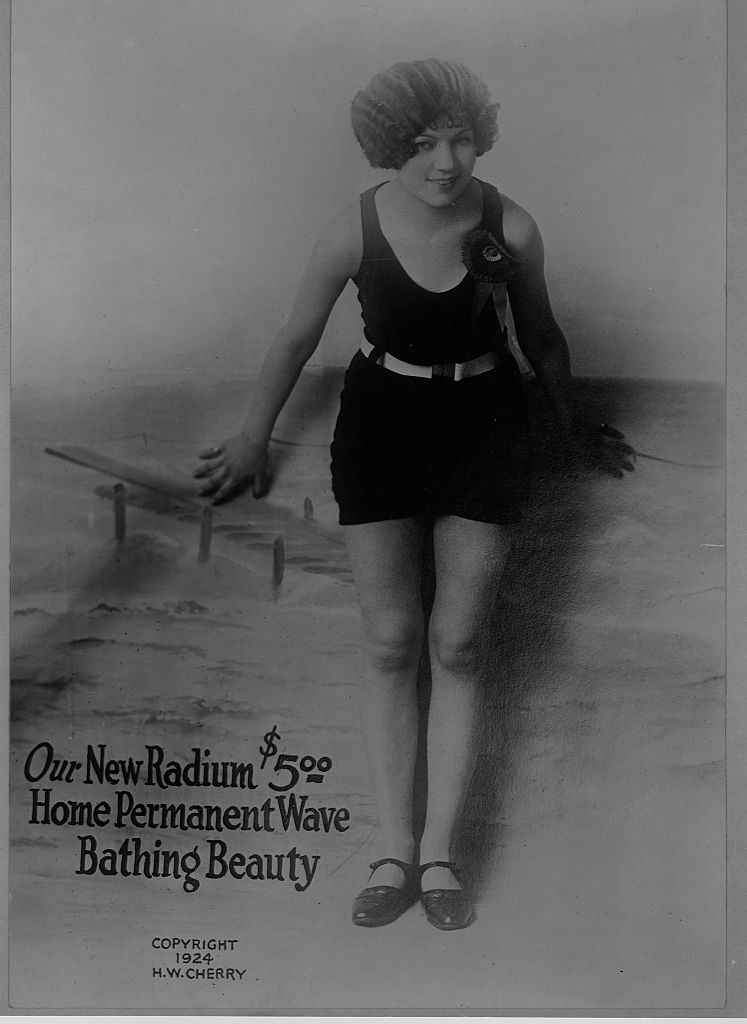 Vintage advertisement with a smiling woman in a bathing suit promoting Radium Home Permanent Wave for $5.00