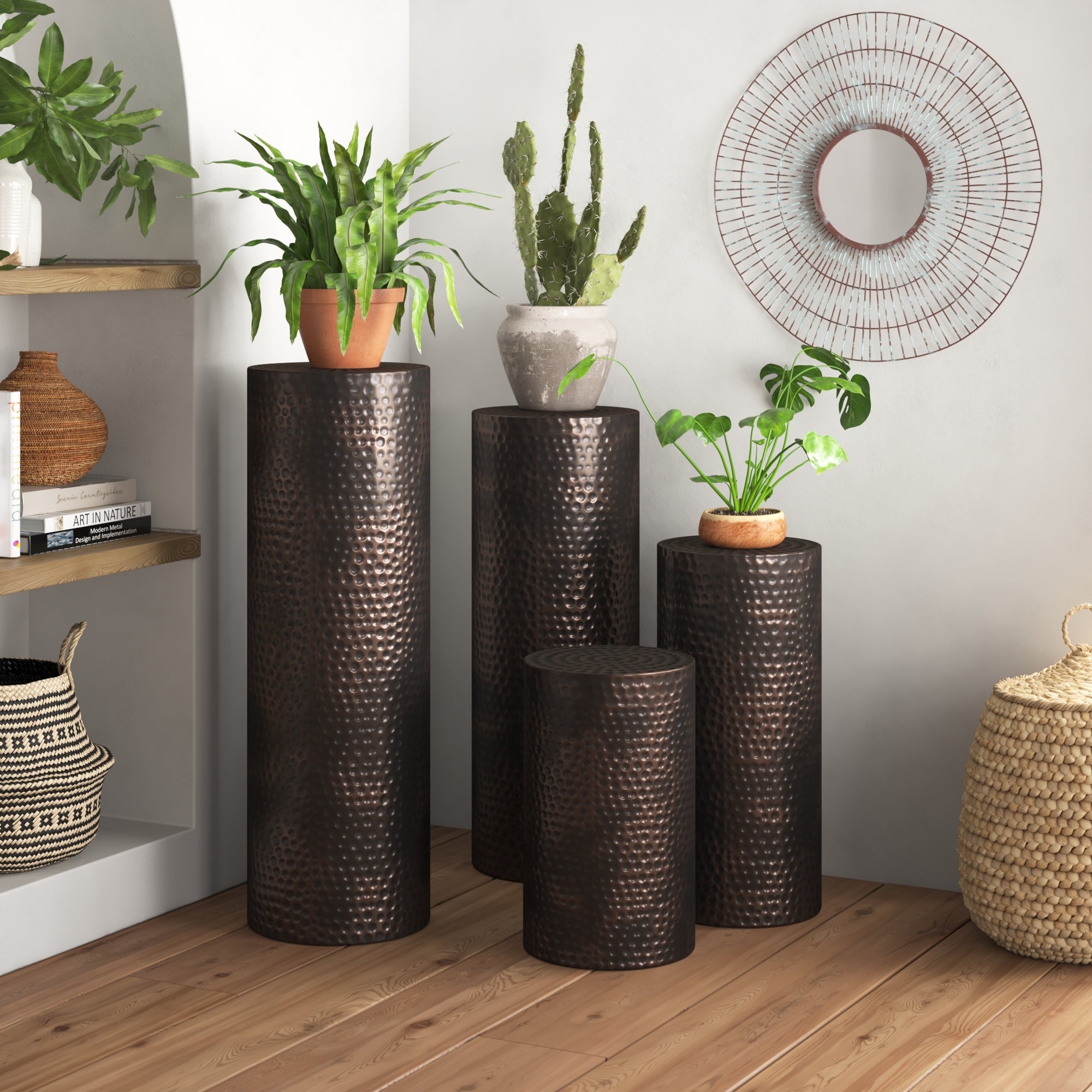 Assorted tall, cylindrical wicker plant stands with green potted plants, in a home interior setting for shopping decor