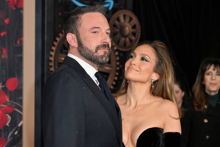 Ben Affleck and Jennifer Lopez at an event, both dressed in formal attire