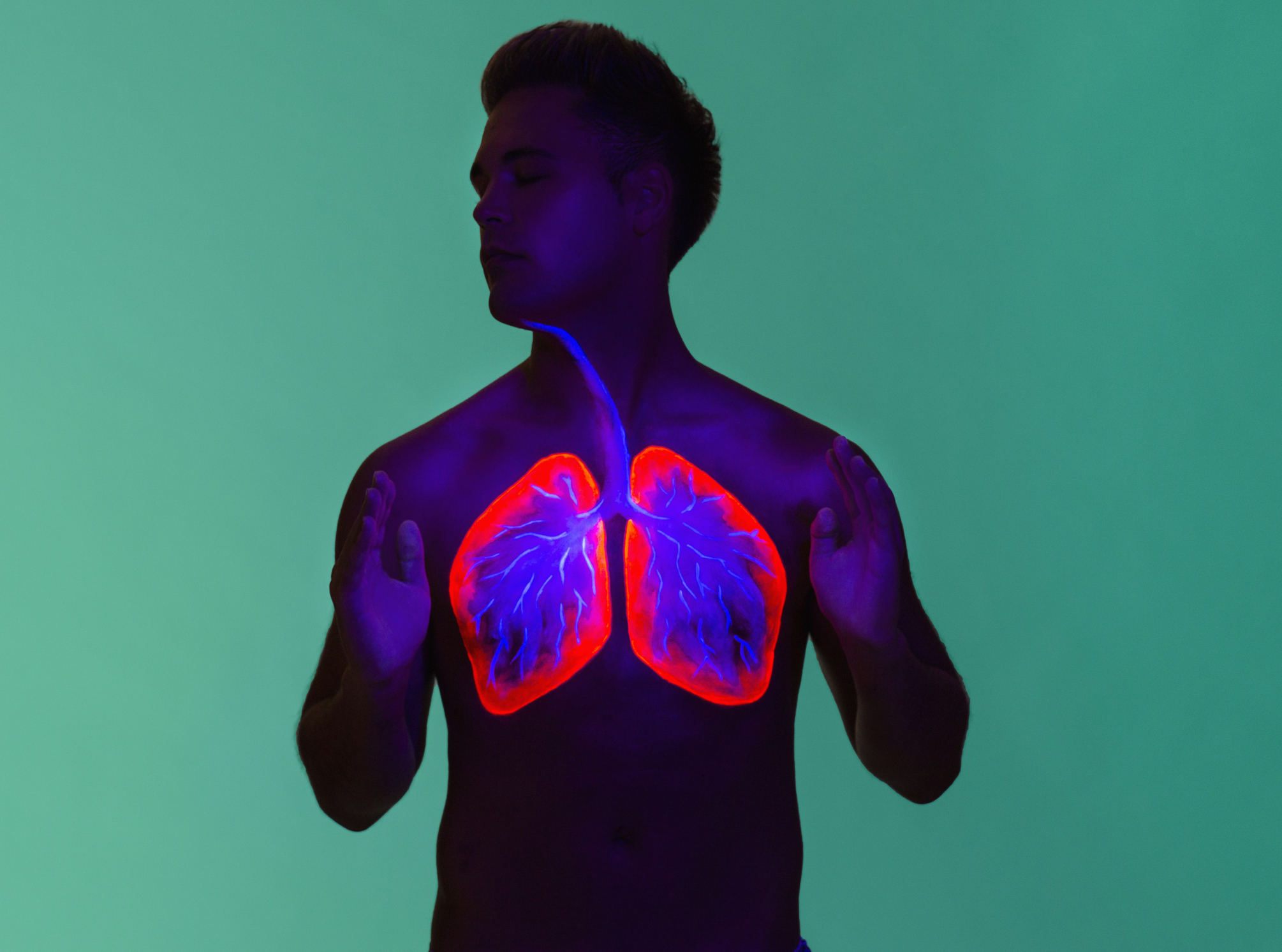 Person with illustrated lungs on chest, stance suggests health concept