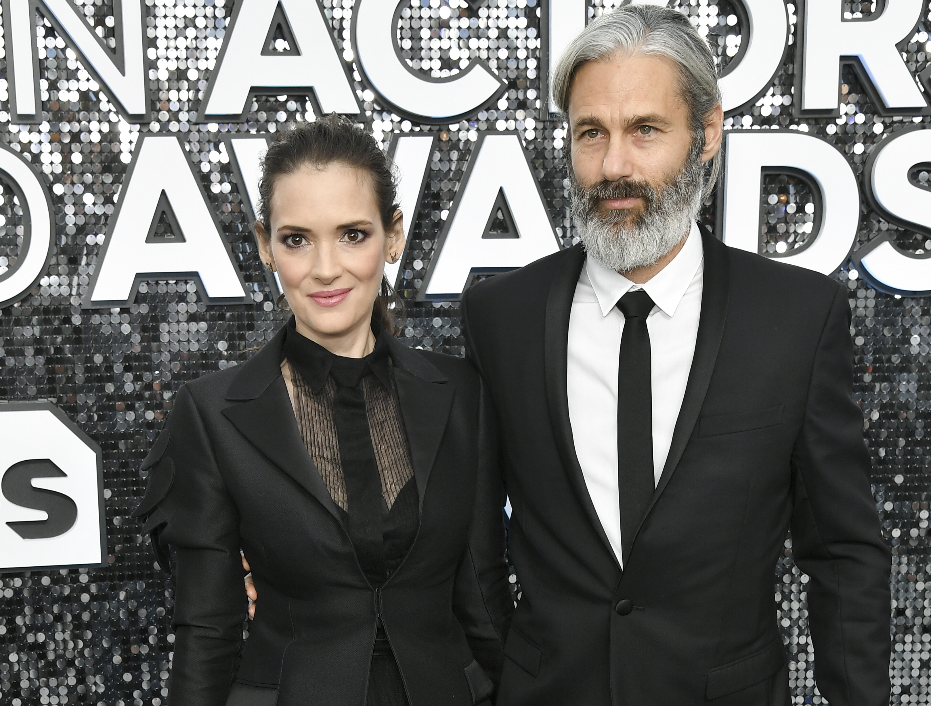 a photo of Winona Ryder and Scott Mackinlay Hahn on the red carpet