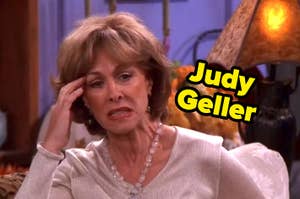 Judy Geller from friends with a hand on her face.