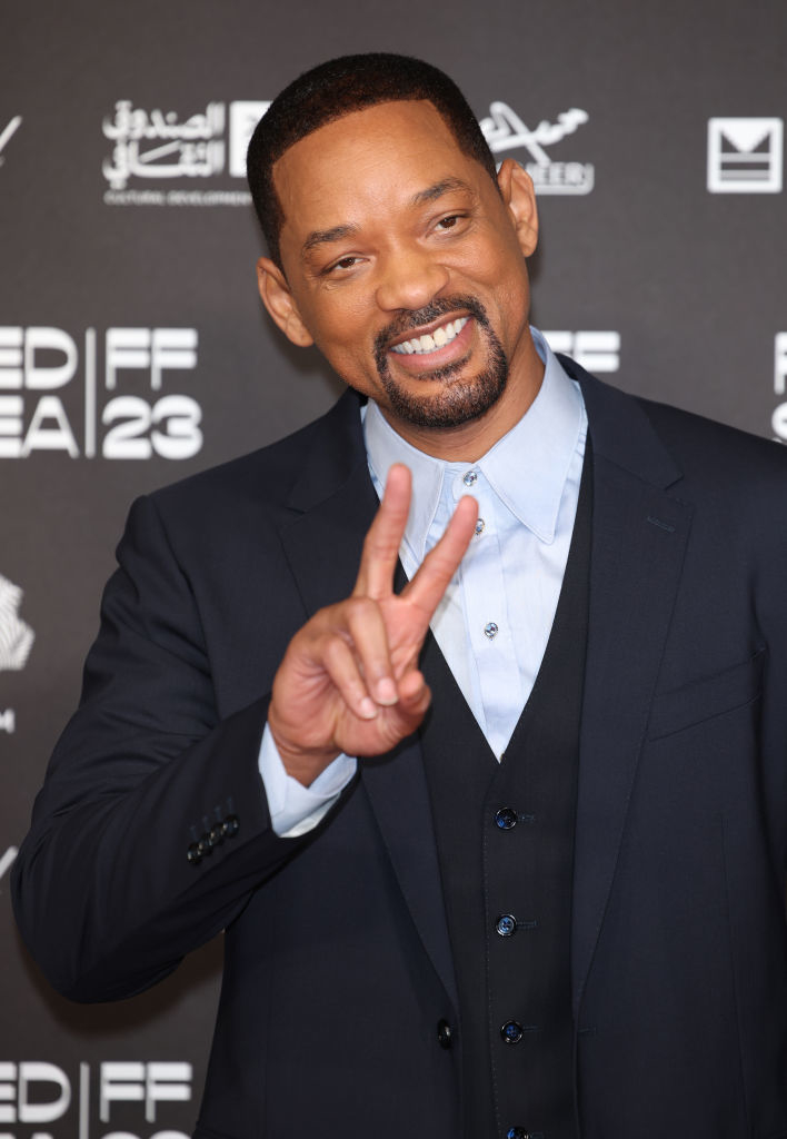 Will making a peace sign gesture at an event wearing a suit and he&#x27;s got a goatee