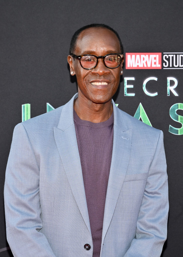 Don wearing a blazer and glasses at a marvel event