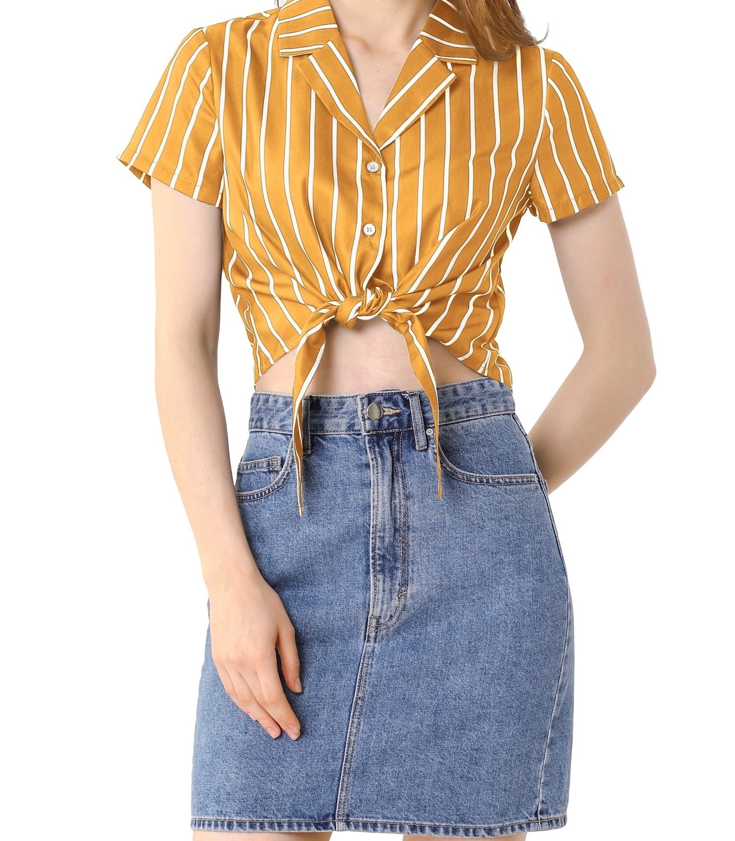 model in a striped tie-front yellow shirt with white stripes and a denim skirt