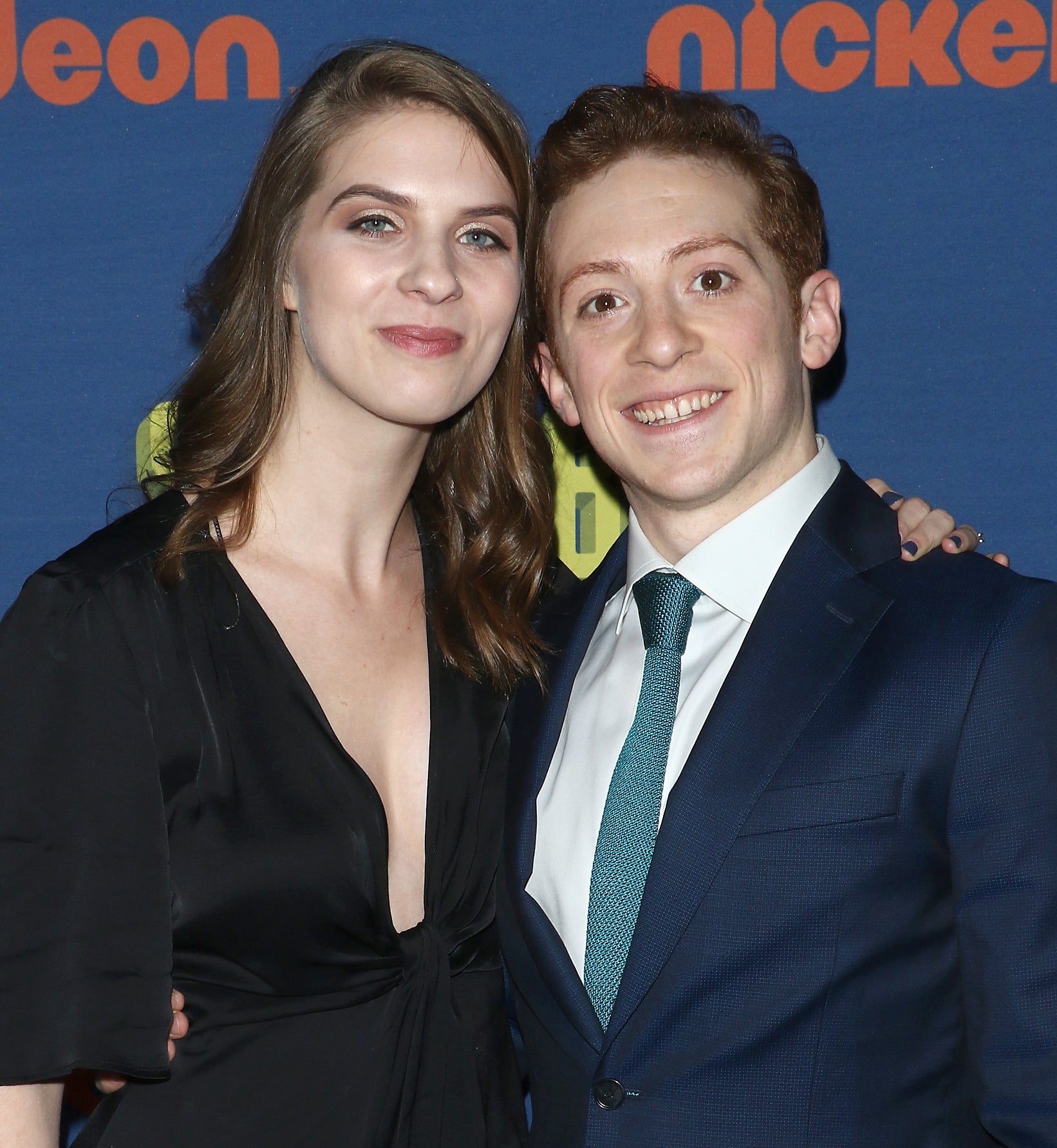 Lilly Jay and Ethan Slater posing together at an event