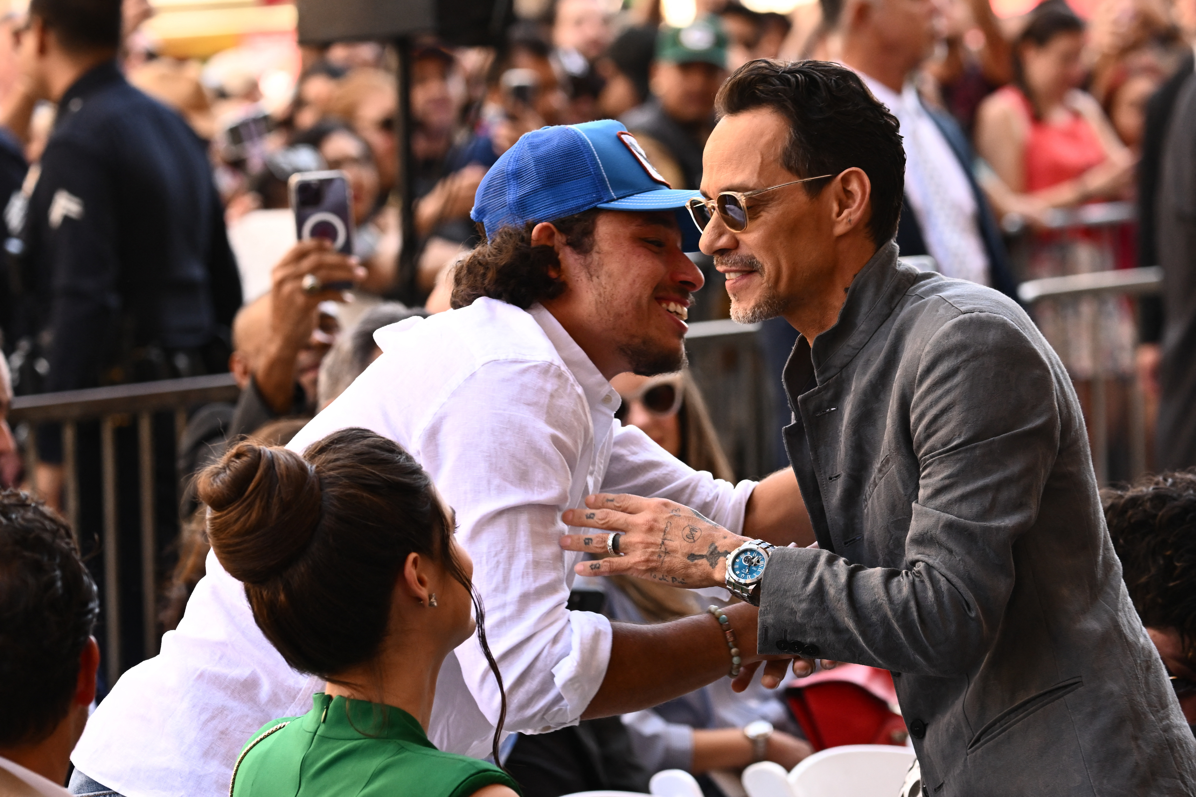 Anthony Ramos hugs Marc Anthony before he receives a star on the Hollywood Walk of Fame