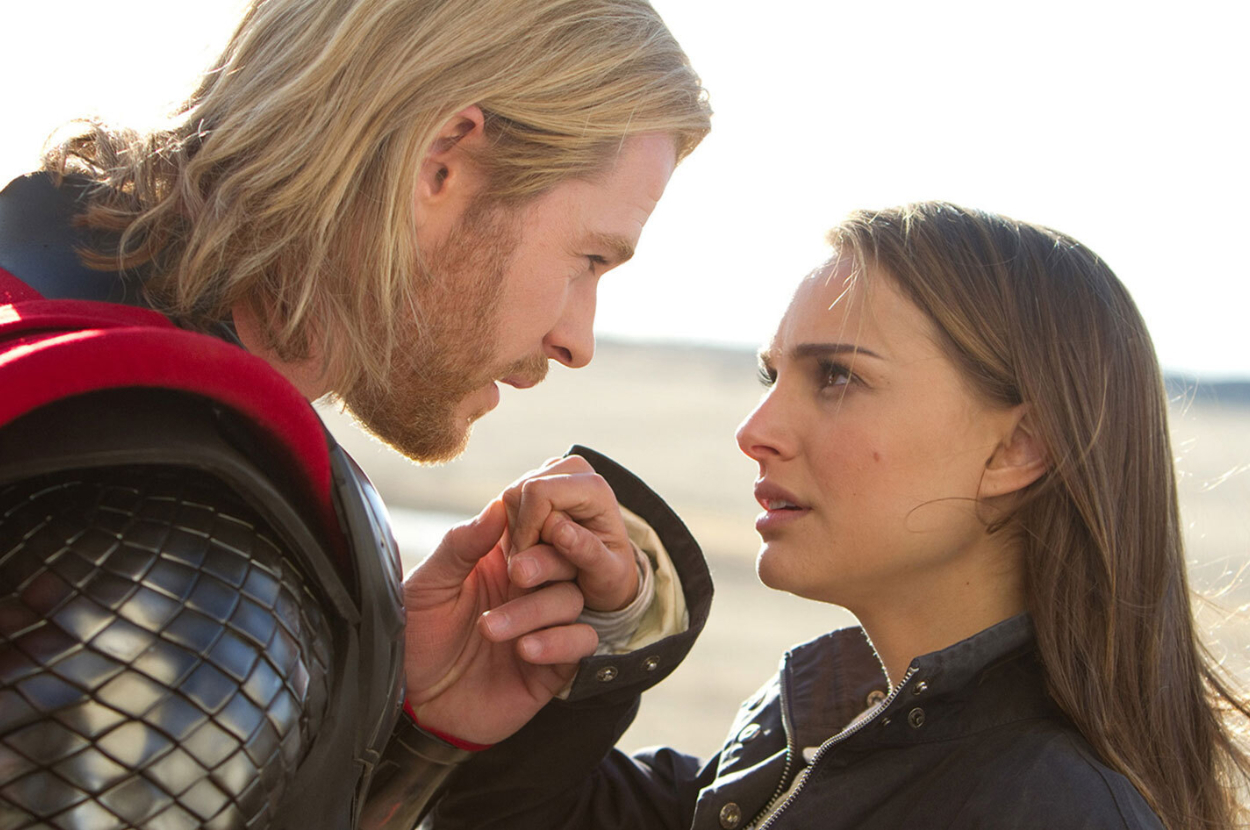 Thor and Jane Foster face each other, close-up, with Thor holding Jane&#x27;s hand gently