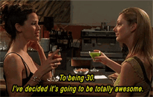 A scene from &#x27;13 Going on 30&#x27; with characters Jenna and Lucy toasting drinks, saying &quot;To being 30. I&#x27;ve decided it&#x27;s going to be totally awesome.&quot;