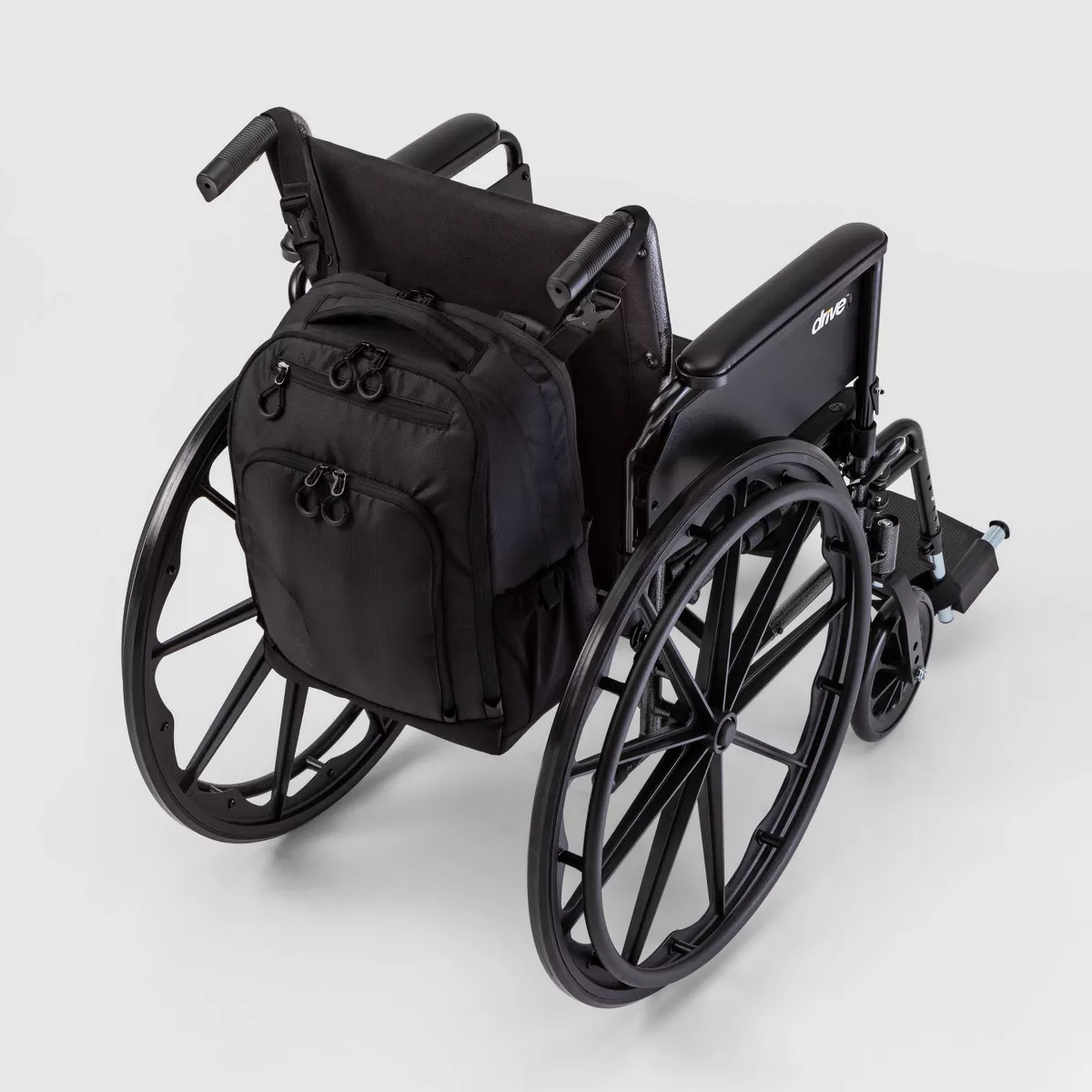 Wheelchair with attached backpack