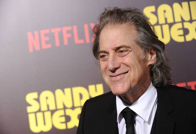 Richard Lewis in a black suit on the red carpet at the 'Sandy Wexler' premiere
