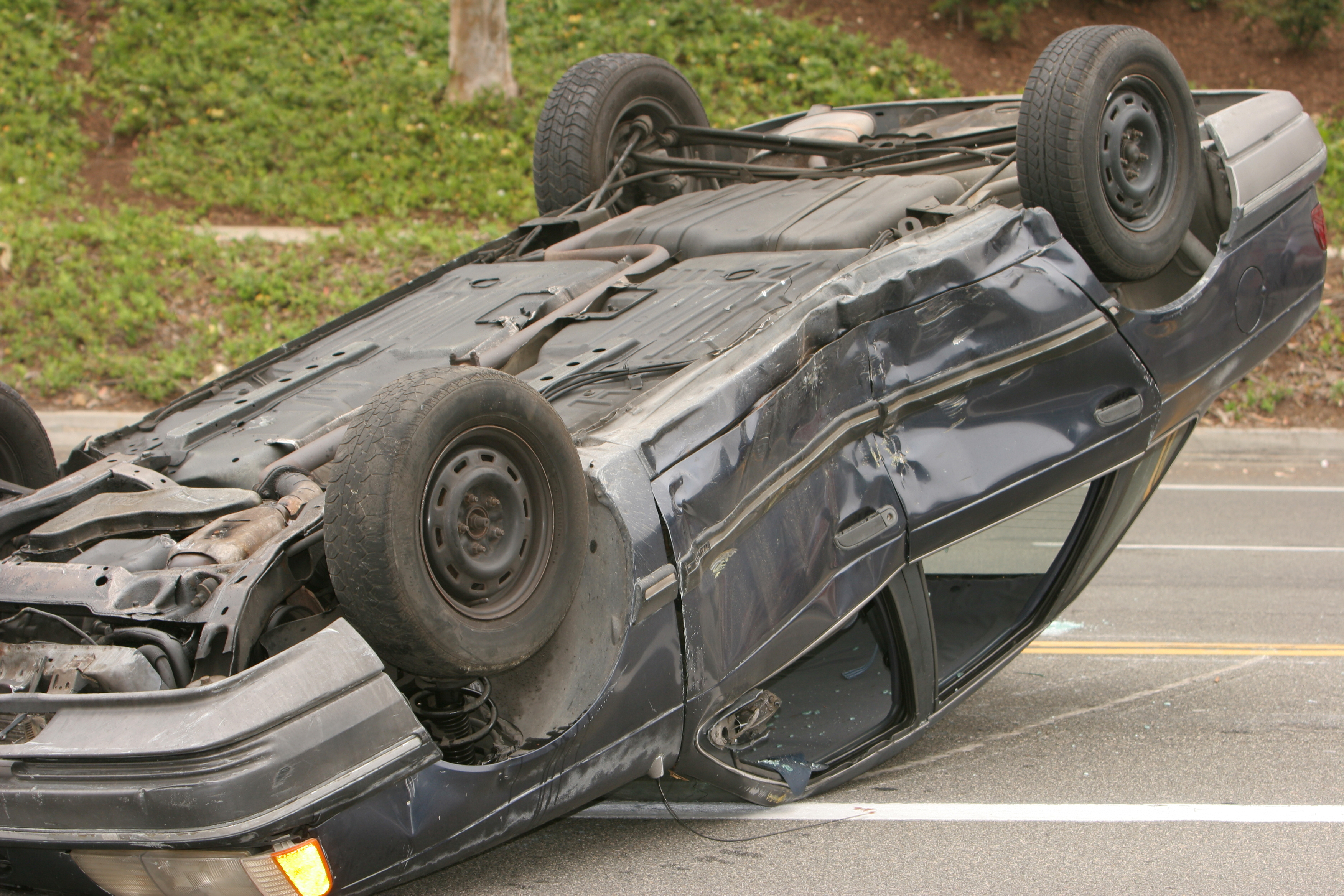 Overturned car on a road after an accident