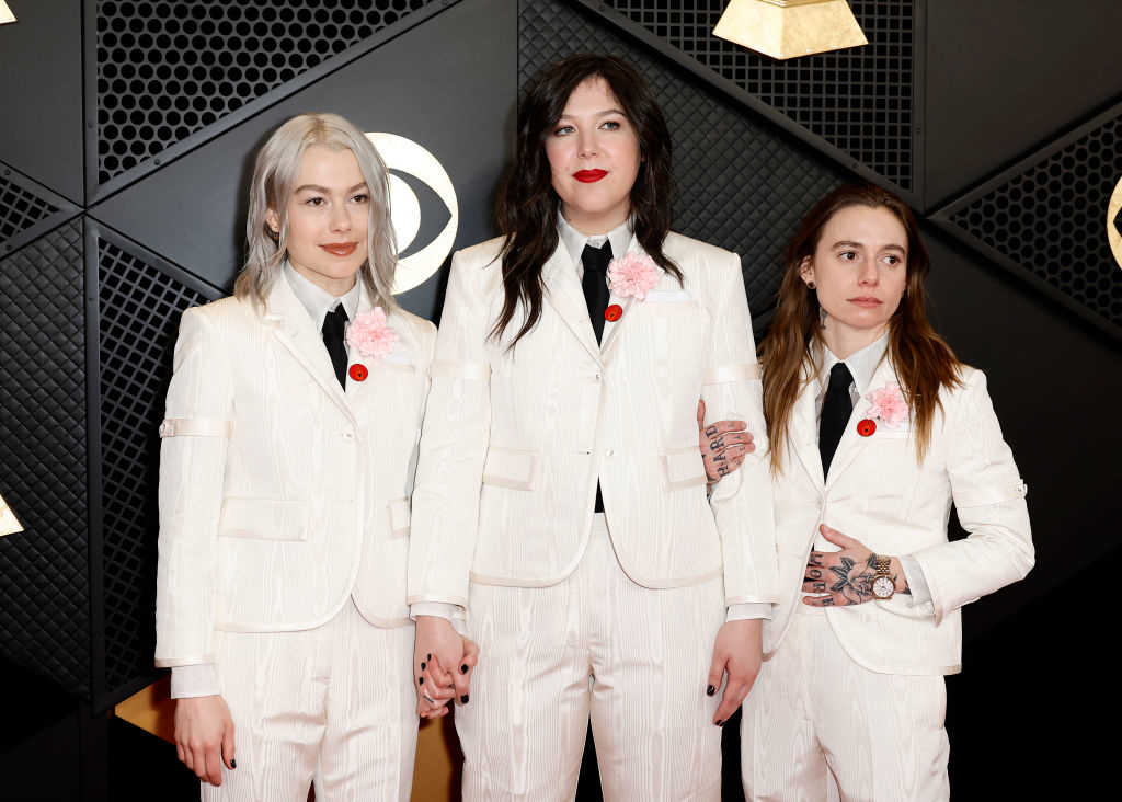 Boygenius in matching suits and corsages on the red carpet