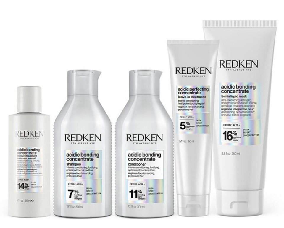 Redken Acidic Bonding Concentrate haircare line including shampoo, conditioners, and leave-in treatment